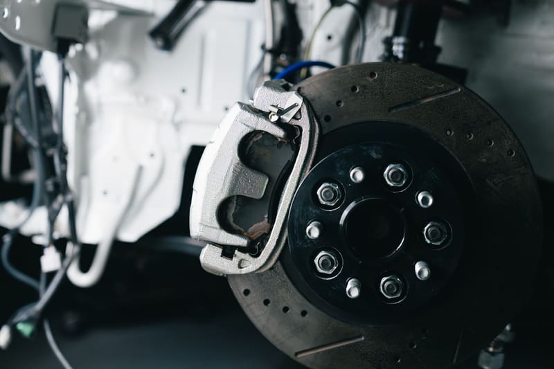 A caliper and disc photographed close, off the car.